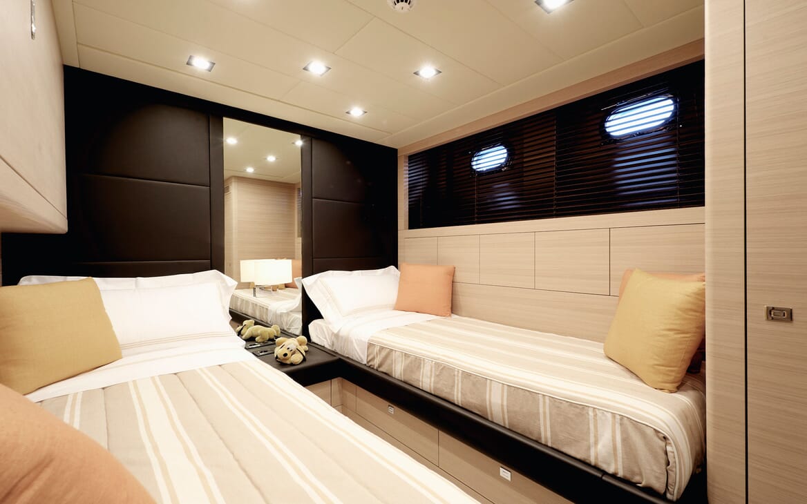 Motor yacht KAWAI twin stateroom with two single beds with low lighting