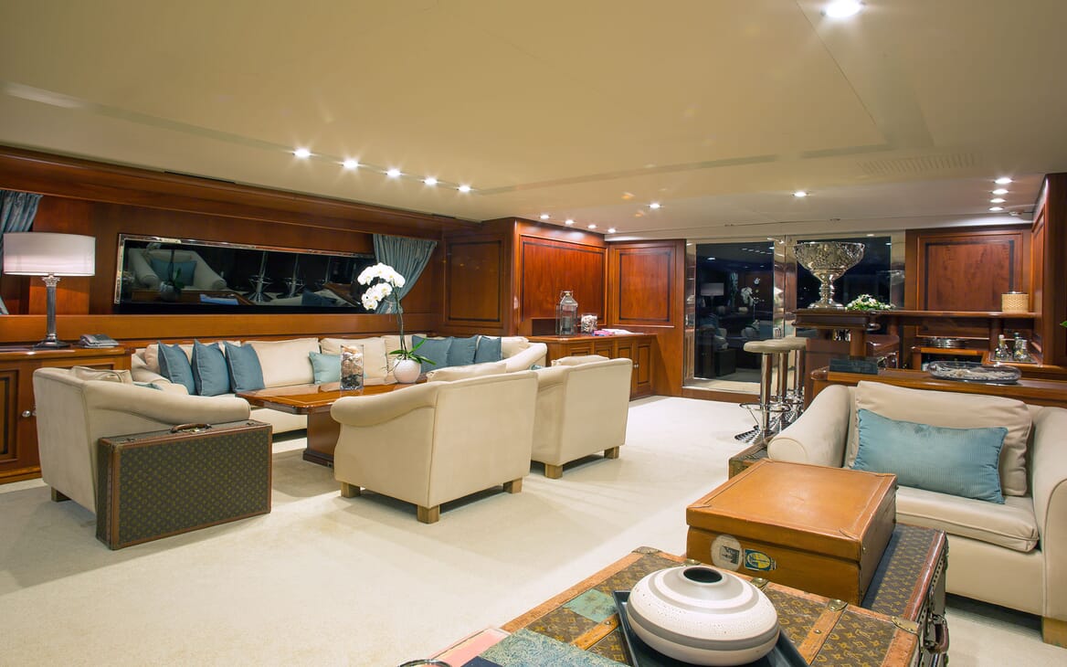 Motor yacht MIRAGGIO interior living room with cream seating and blue furnishings