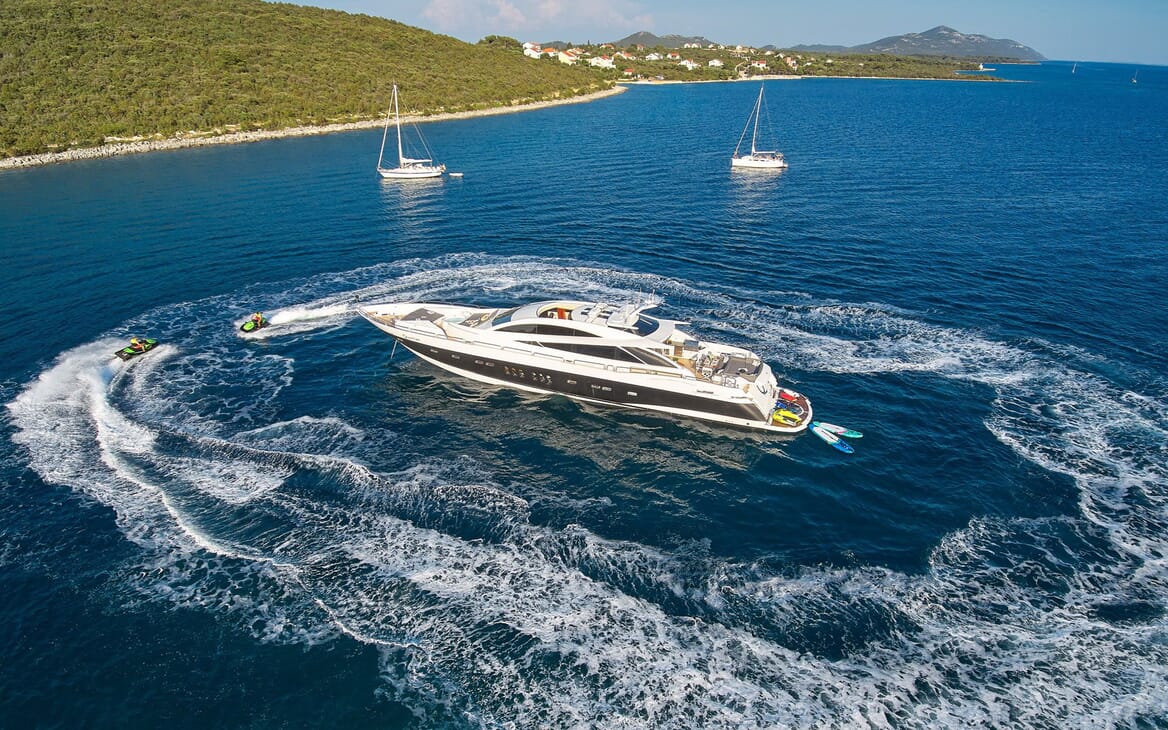 Motor yacht Quantum aerial shot with jet skis