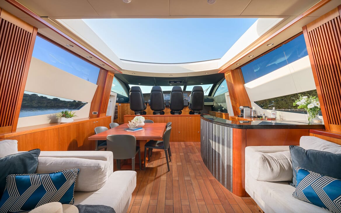Motor Yacht Quantum aerial interior living room shot and dining area, views of the cockpit