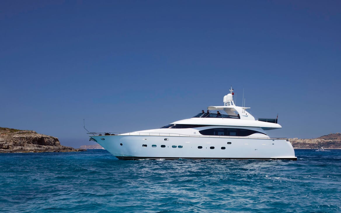 Motor yacht MEME hero shot on turquoise water and blue sky