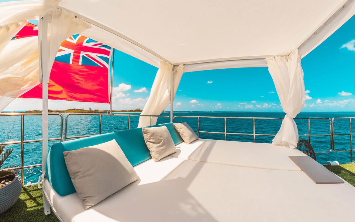 Motor yacht SAMARA upclose shot of outdoor lounge matress, views of turquoise water