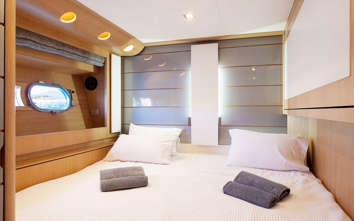 Motor Yacht SLIP AWAY double stateroom with contemporary lighting and white bed linen