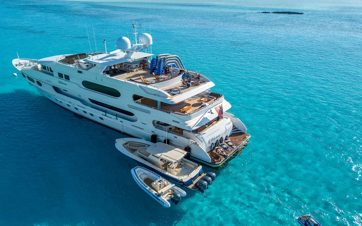 Motor yacht MILESTONE aerial shot on turquoise water and tender