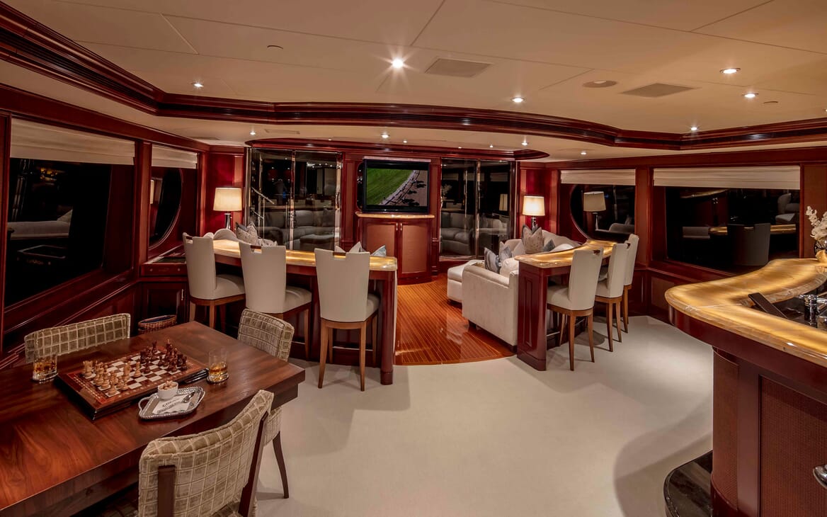 Motor yacht MILESTONE bar area with stool seating